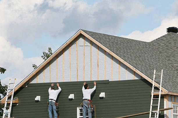 Professional Vinyl Siding technician working in Champion, PA
